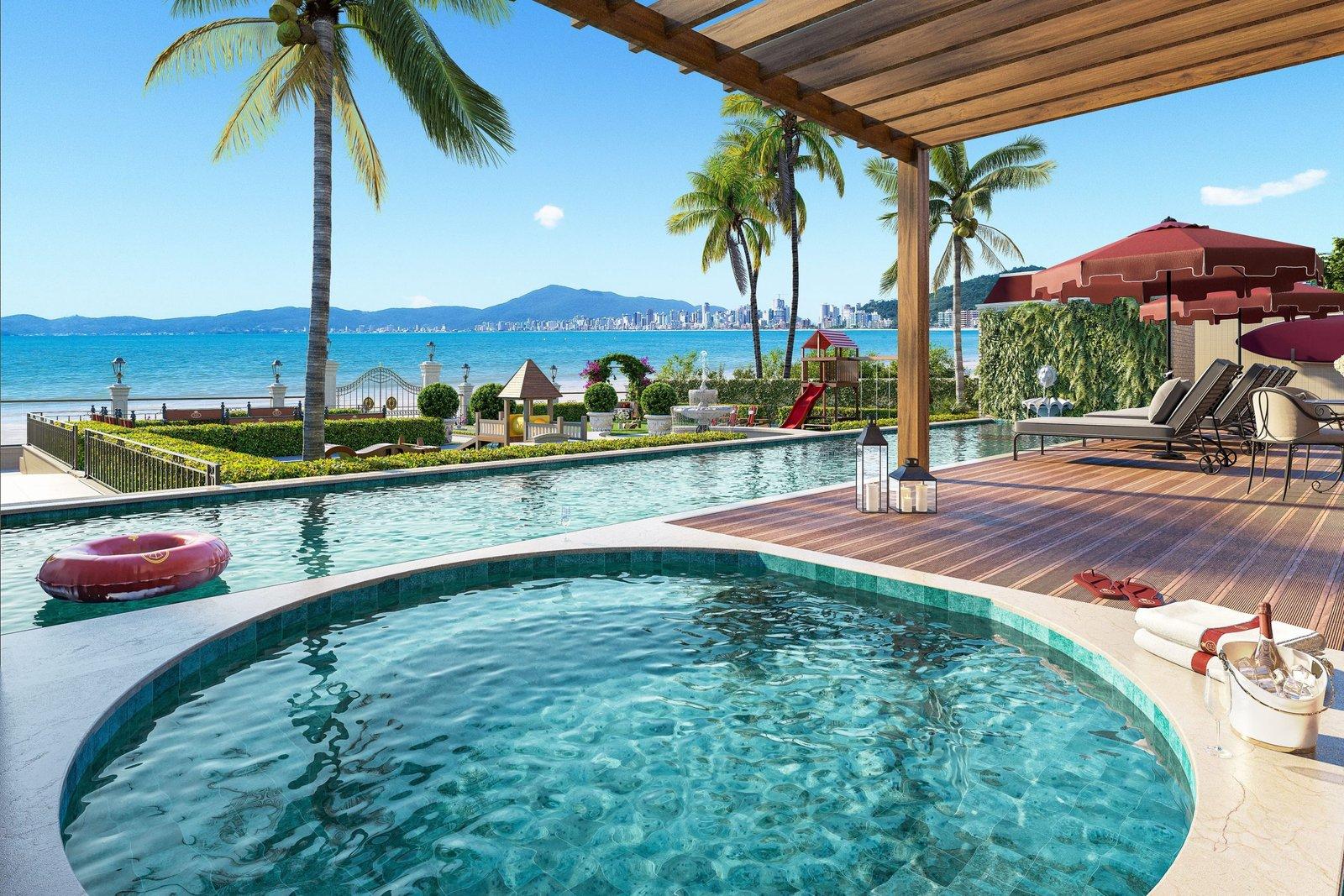 Piscina de borda infinita do George VI Residencial, com o mar e o skyline de Itapema ao fundo